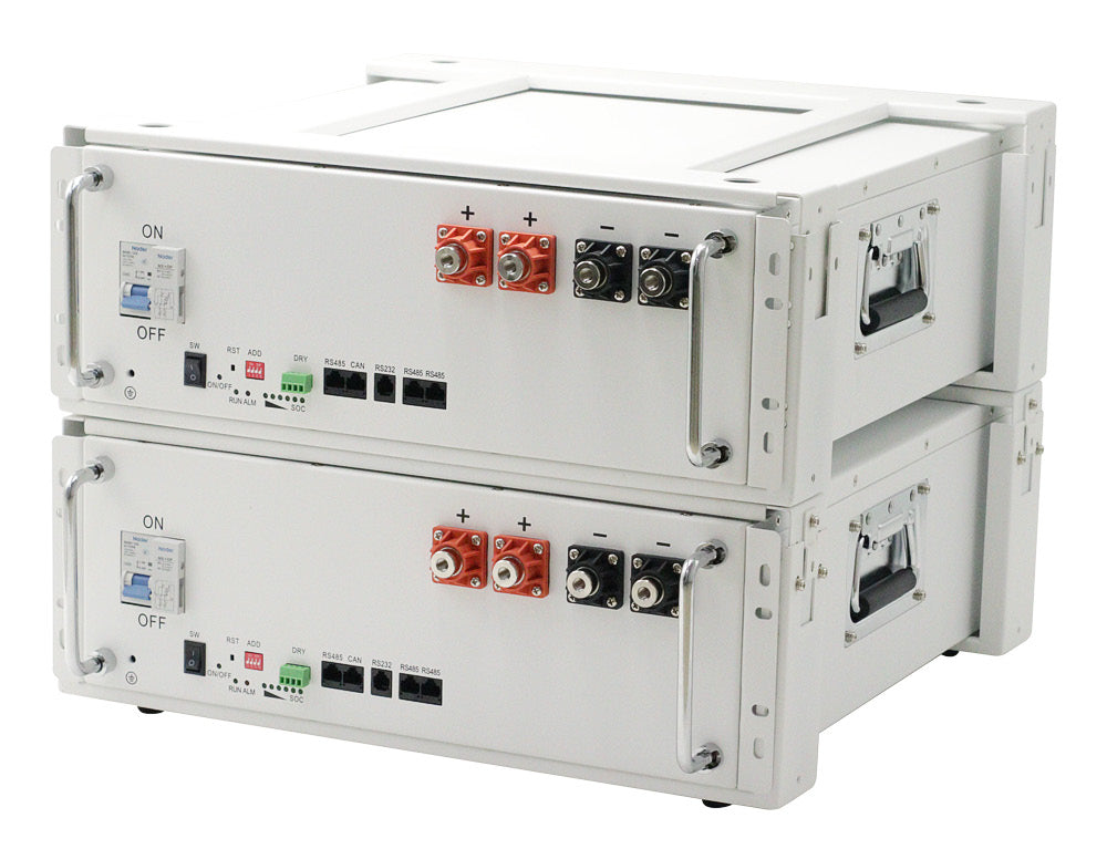 Two stacked white battery modules with terminal connections, on/off switches, and side handles for portability.