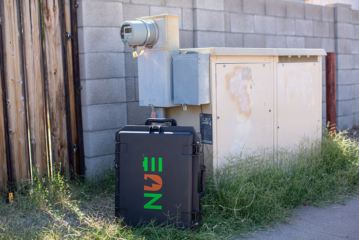 NUE 36V DC battery generator beside a utility cabinet