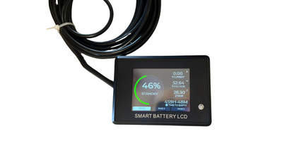 Smart battery LCD display showing charge status at 46%, with connected cable coiled beside it.